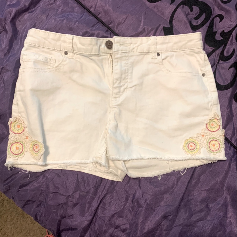Junior cute shorts with embroidery on them.